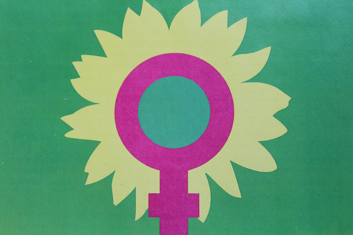 Das Venussymbol in der Sonnenblume der Grünen